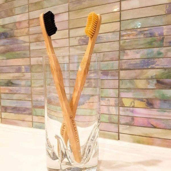 Bamkiki_Sustainable_Eco_Friendly_zero waste oral care bamboo toothbrush adult size blac and naturel two pieces multipack in the glass