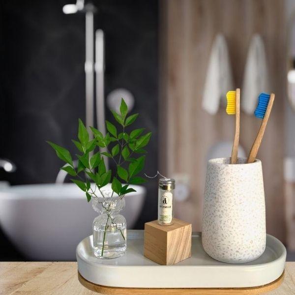 Bamkiki_Sustainable_Eco_Friendly_zero waste oral care bamboo toothbrush adult size limon azur yellow blue two pieces multipack in the bathroom background