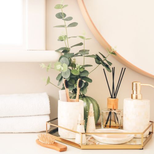 Bamkiki toothbrush as an eco friendly biodegradable sustainable bamboo toothbrush display on a tray in zero waste bathroom