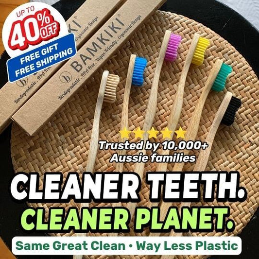 Bamboo toothbrushes with colorful bristles displayed next to their brown cardboard packaging on a woven mat background, with promotional text overlays including 'CLEANER TEETH. CLEANER PLANET.